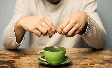 Man using artificial sweetener