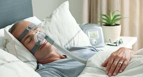 Man Using a CPAP Machine