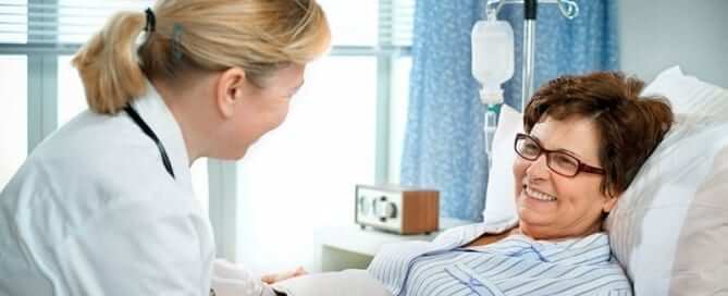 Doctor talking to patient in hospital