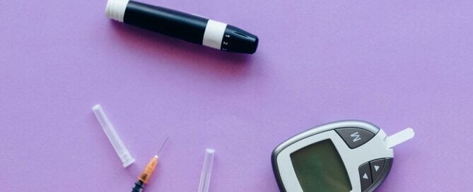 Insulin supplies on a purple surface