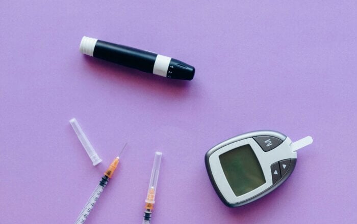 Insulin supplies on a purple surface