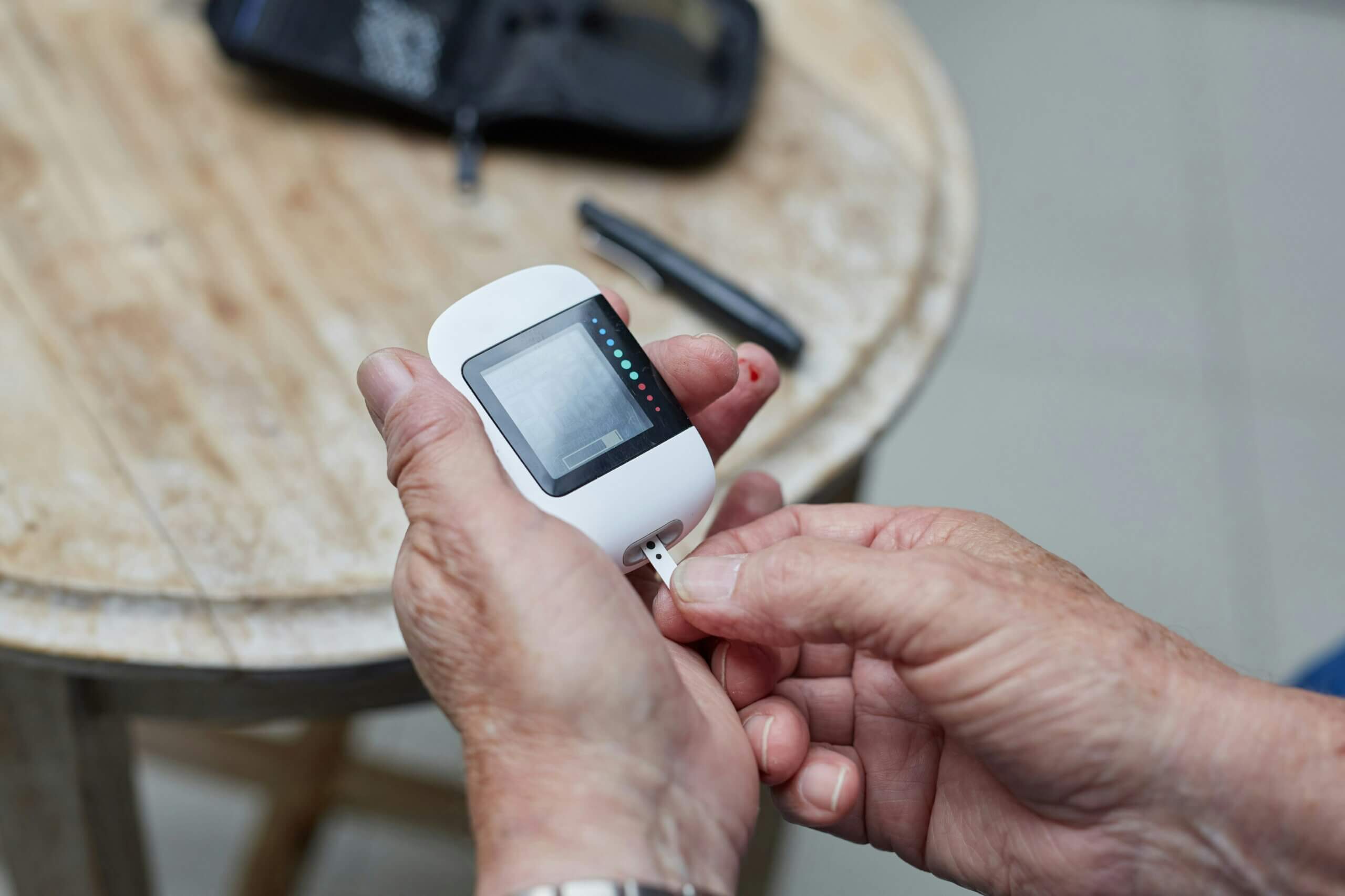 A person testing their blood sugar levels