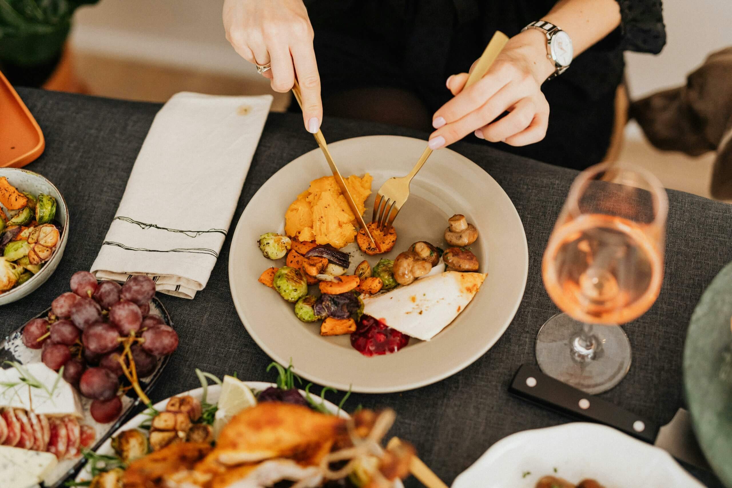 A person eating roasted vegetables