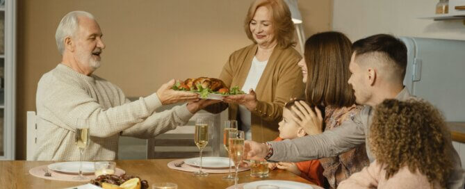 A family getting ready to eat a Thanksgiving dinner