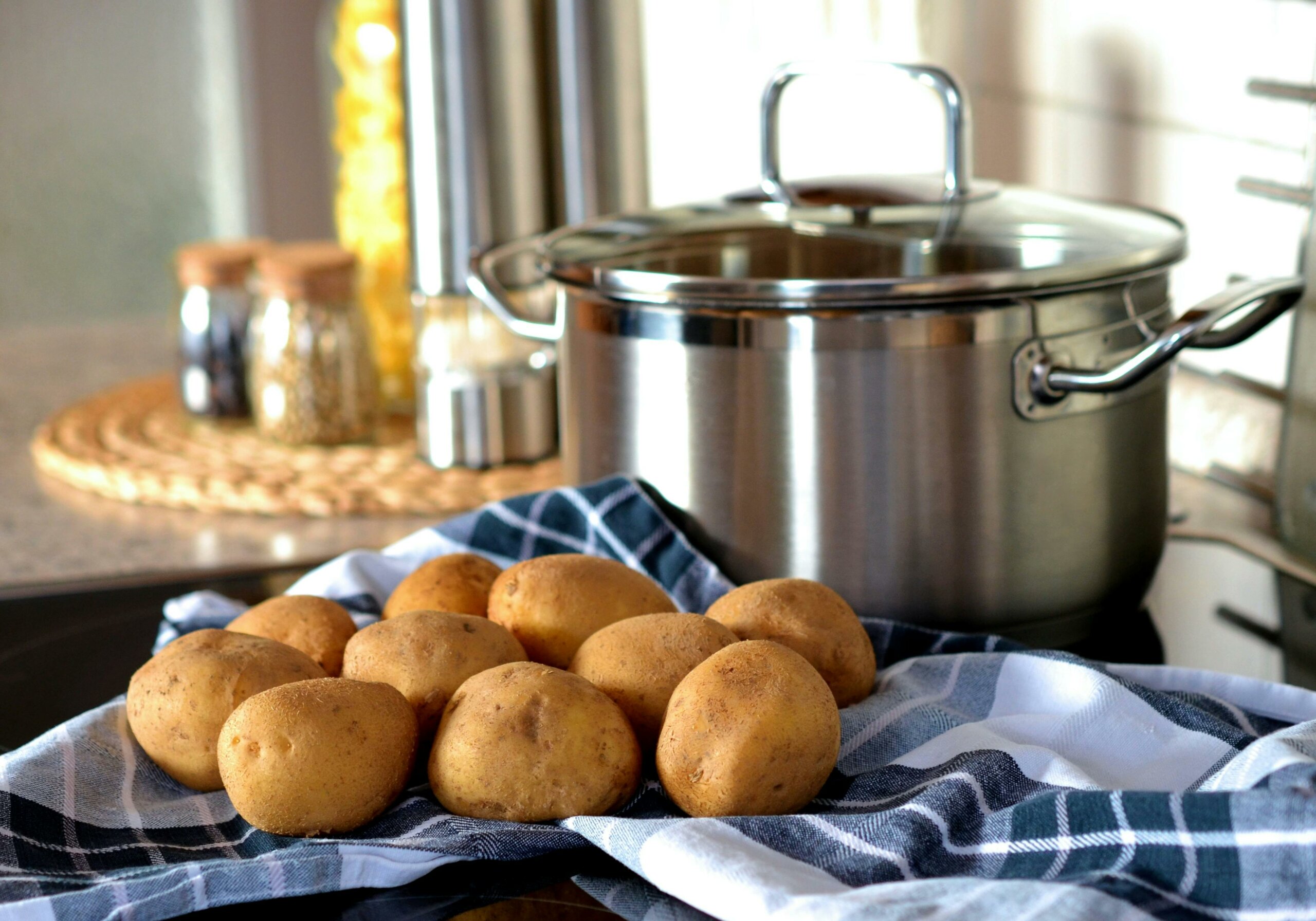 Potatoes next to a cooking pot