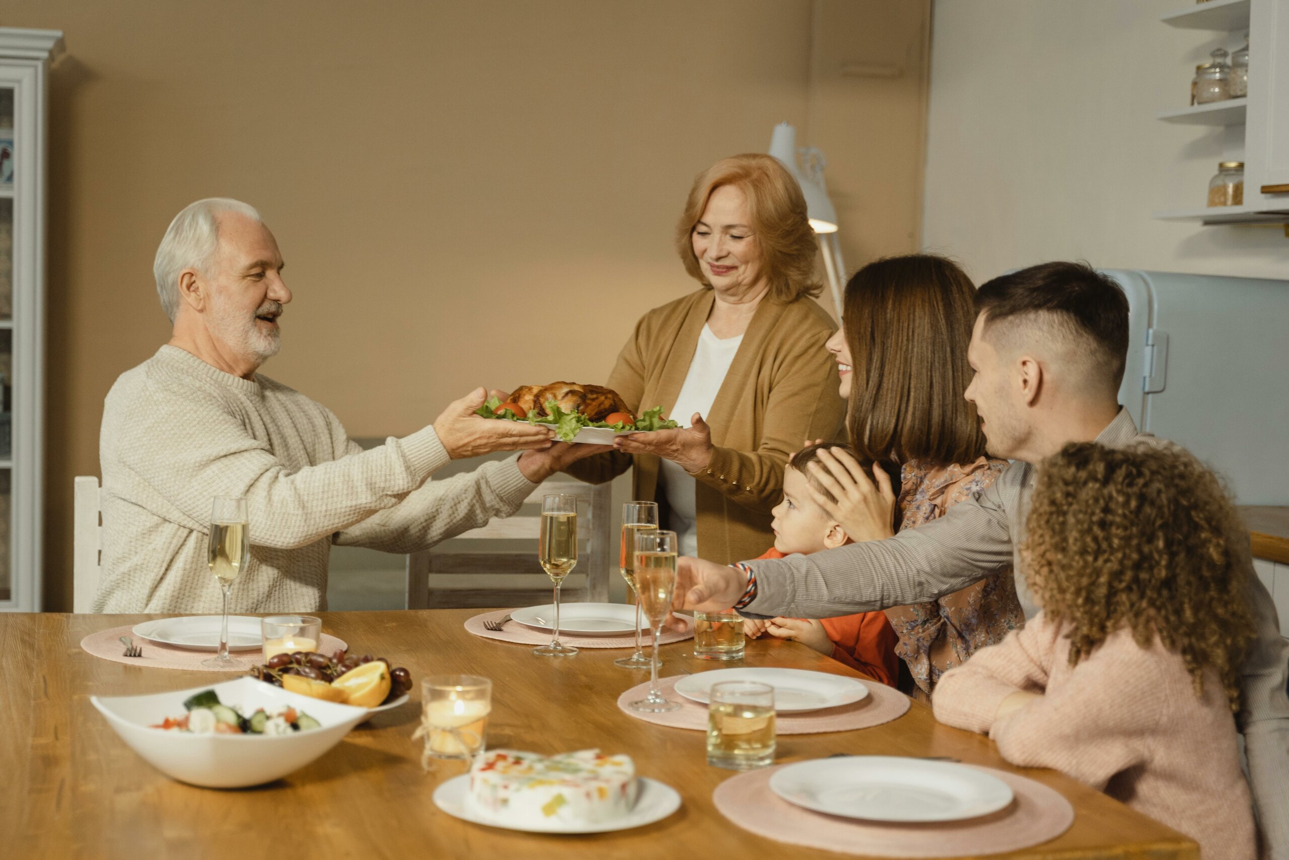 A family getting ready to eat a Thanksgiving dinner