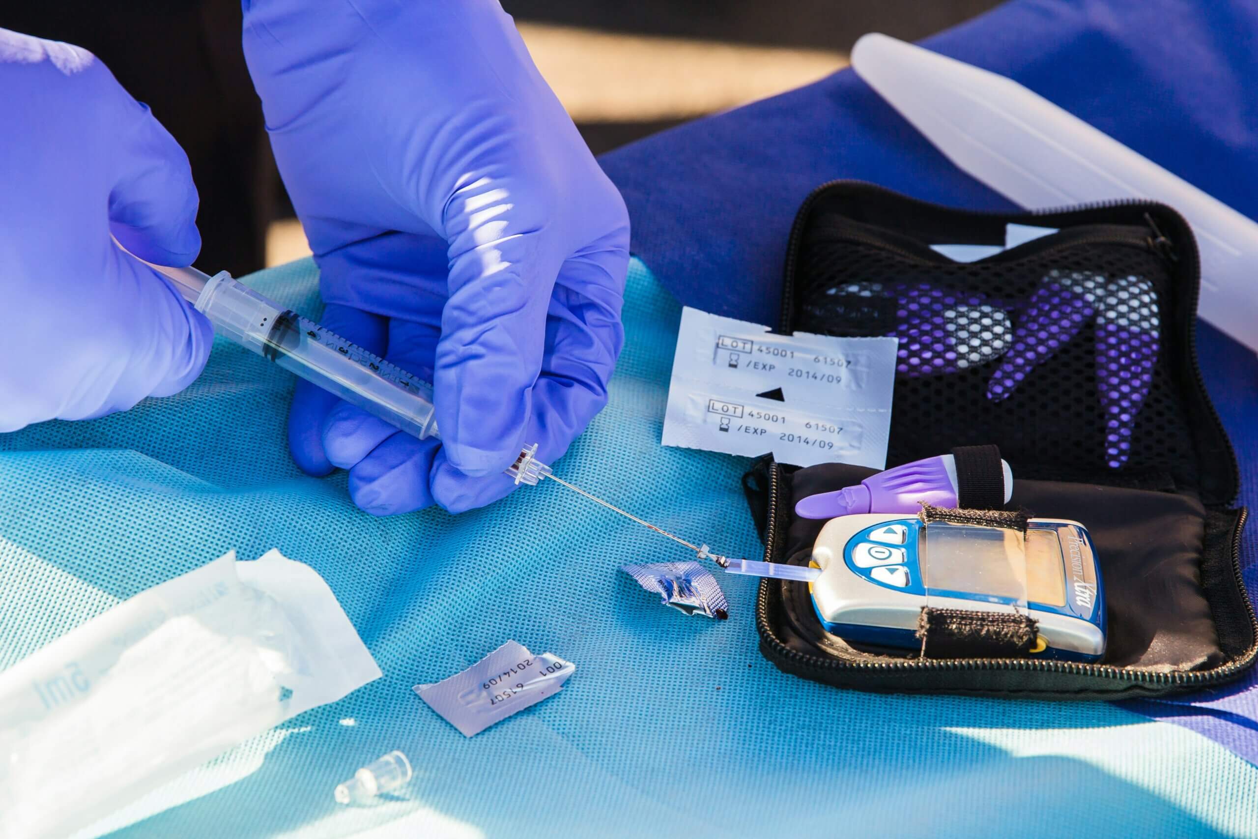 A person filling an insulin pump