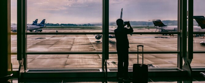 A person in the airport watching the planes