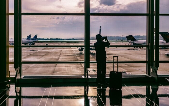 A person in the airport watching the planes