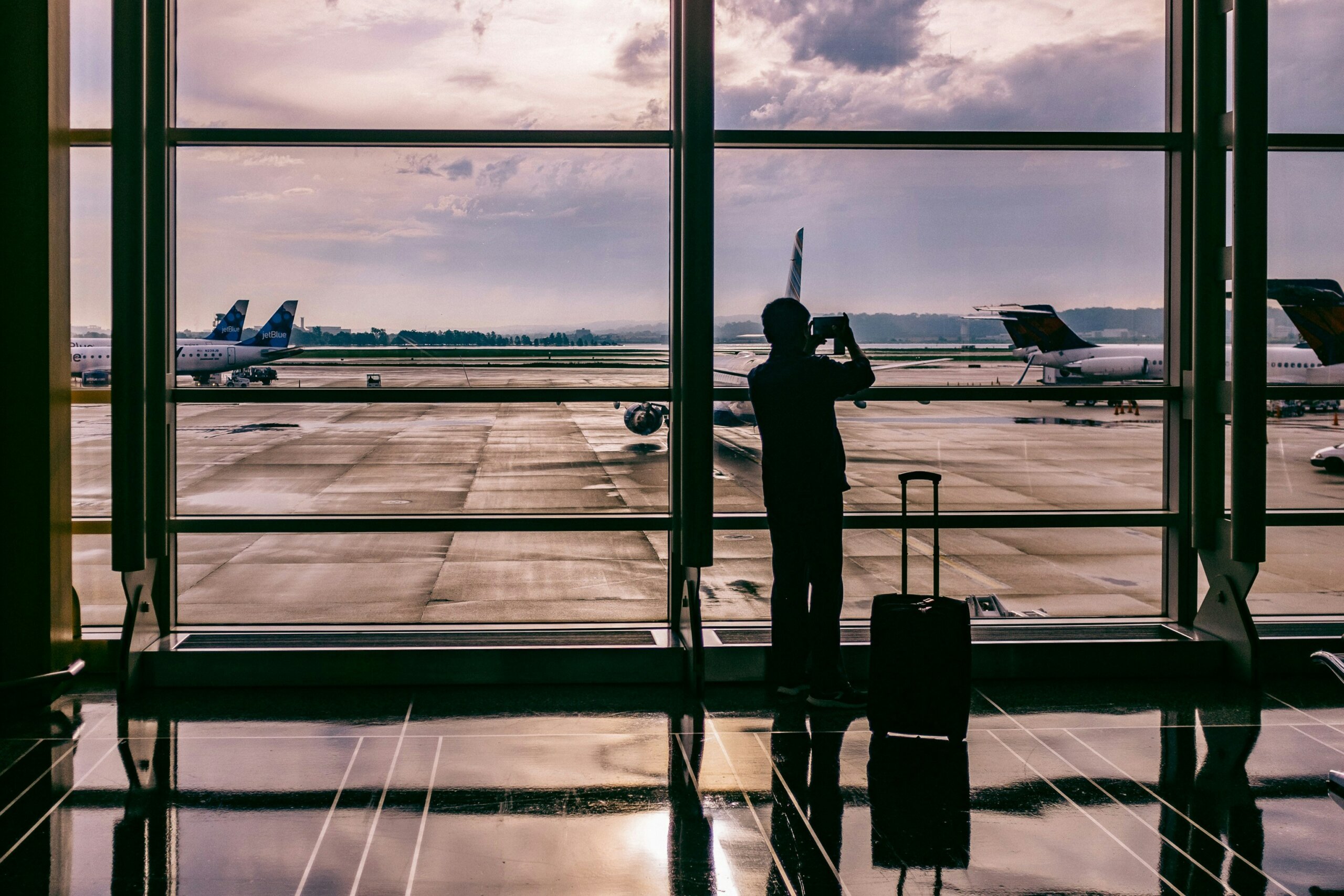 A person in the airport watching the planes